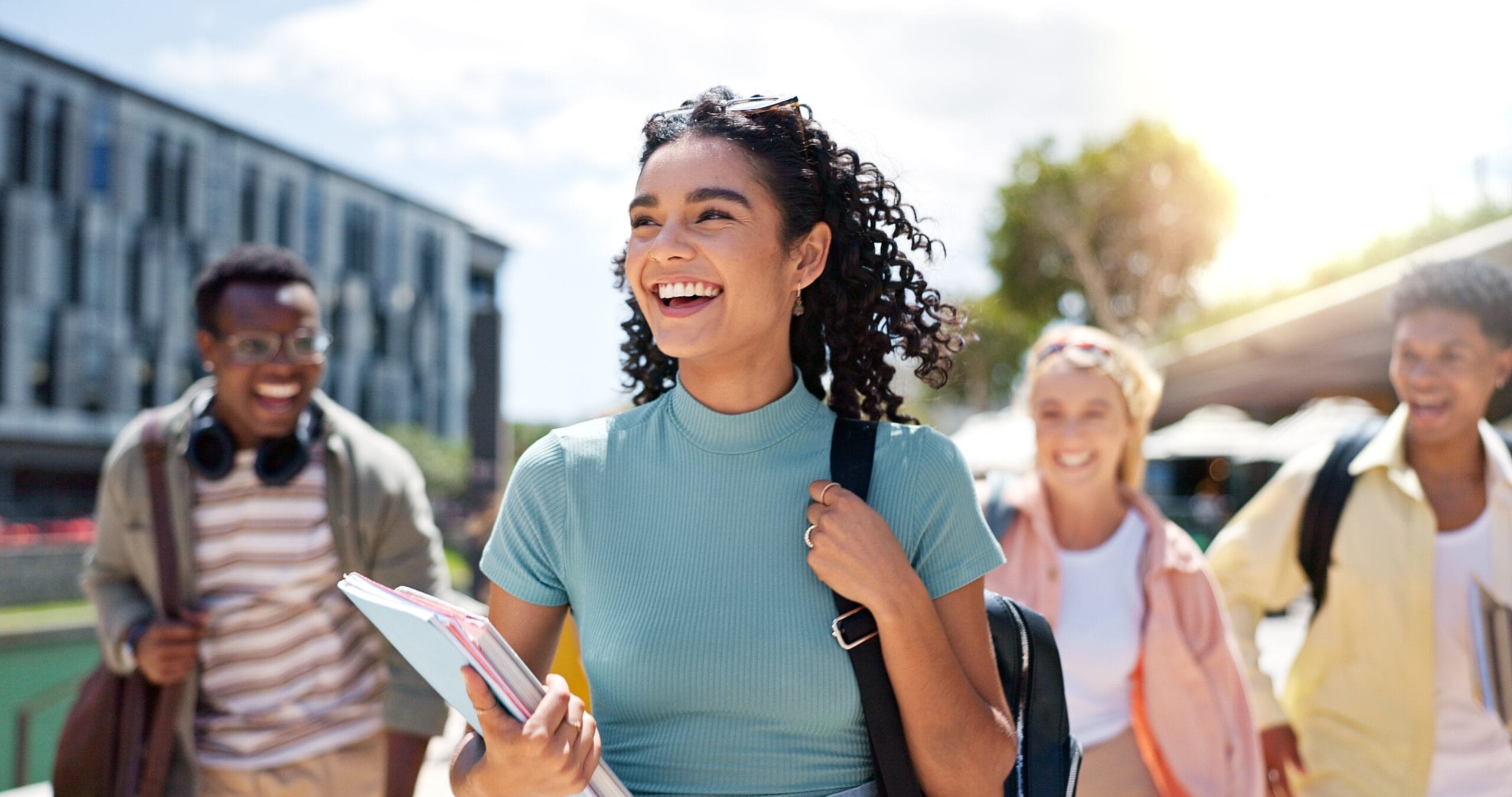Teens building social skills at a summer immersion program on a college campus.